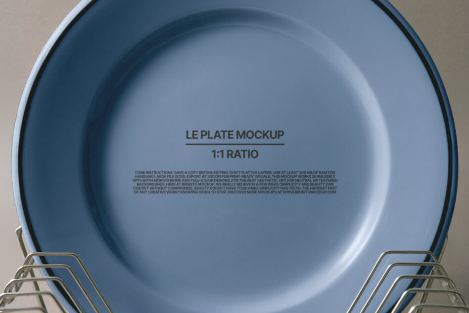 Blue dinner plate in tiered metal dish racks on neutral backdrop