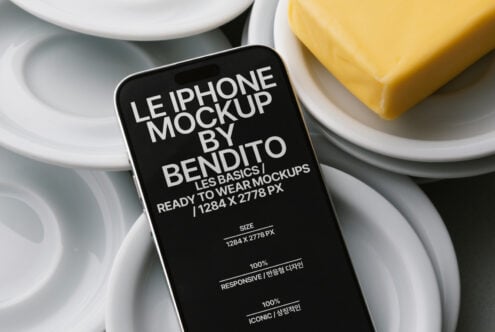 Dark iPhone mockup centered on white plate with butter bar nearby