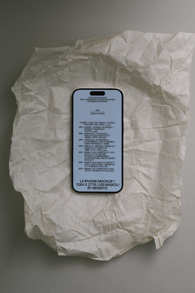 iPhone mockup with light blue screen on crumpled tissue paper, showing Le iPhone Mockup