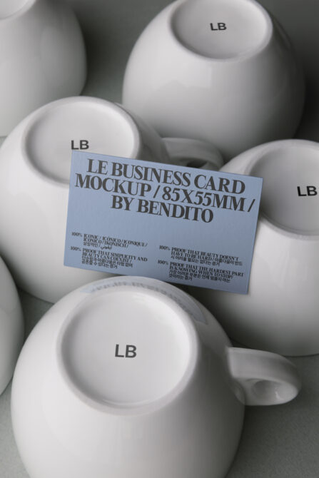 Light blue business card mockup on white ceramic bowls with LB branding