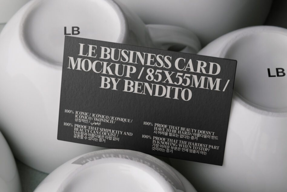 Dark charcoal business card mockup displayed on white ceramic bowls