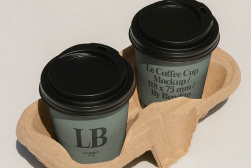 Sage green coffee cups with black lids in kraft paper holder, LB logo visible