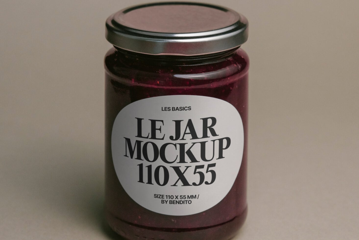 Maroon glass jar mockup with white label on neutral beige backdrop