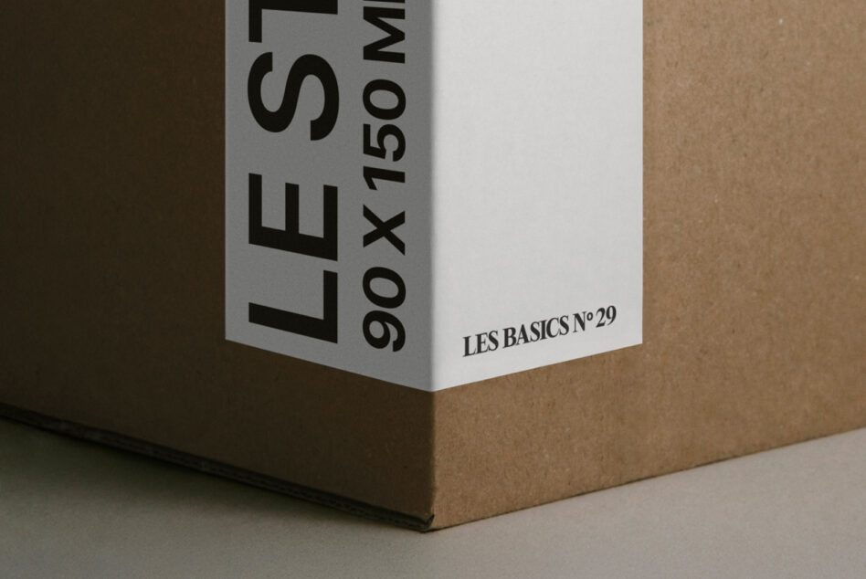 Corner detail of white box with kraft paper background in studio lighting
