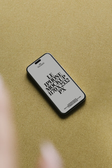 iPhone 14 Pro mockup on beige fabric with white screen displaying text