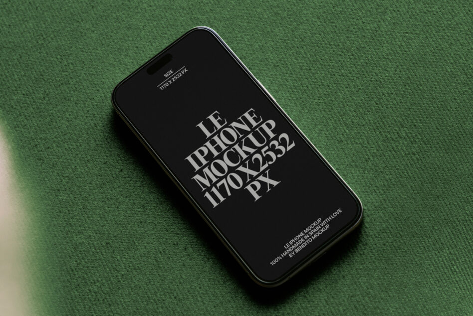 iPhone 14 Pro mockup on green fabric with black screen displaying text
