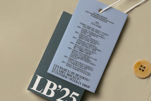 Periwinkle hang tag with multilingual care text on charcoal backing styled flat