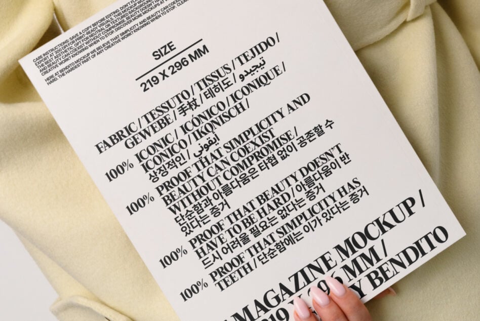 Close up of printed care label with multilingual text on cream fabric mockup