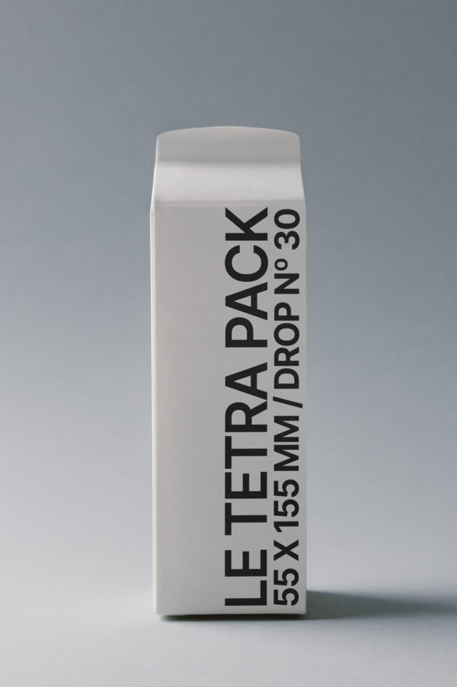 Off-white rectangular tetra pack mockup with vertical text layout
