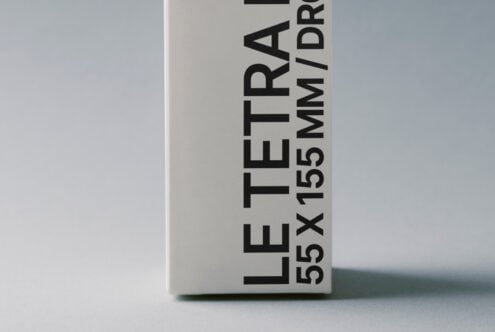 Cream-colored tetra pack shown from angled side view with text
