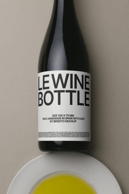 Clean wine bottle mockup with white label sat above yellow liquid in bowl