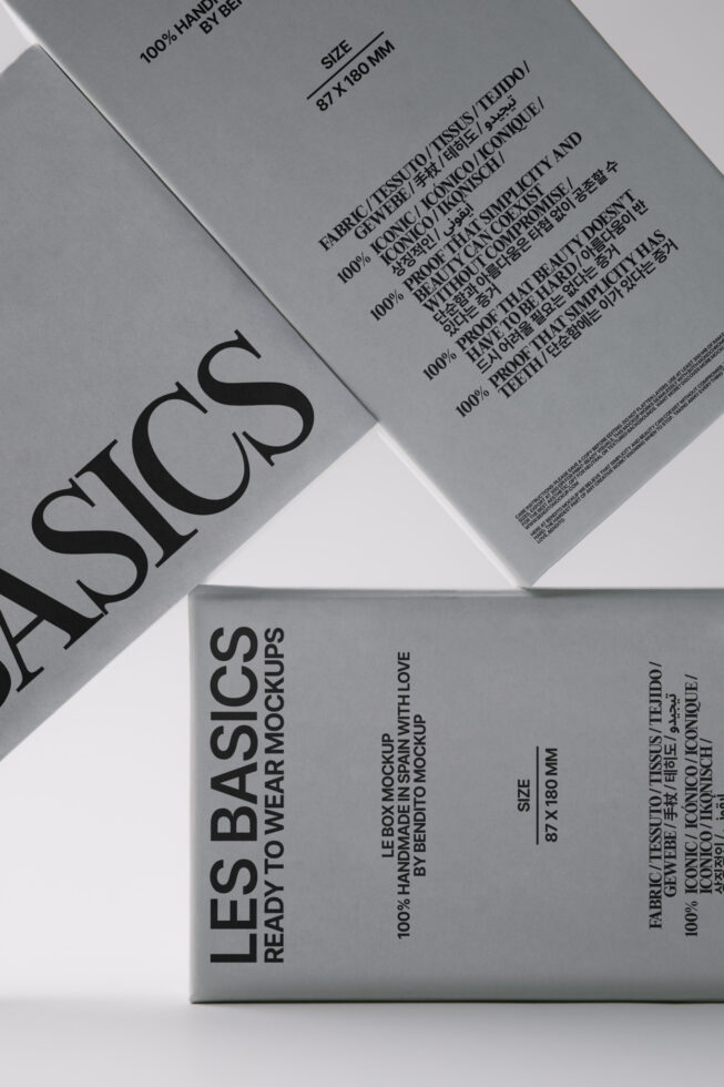 Overhead shot of black, white, gray clothing tags fanned out with product specs