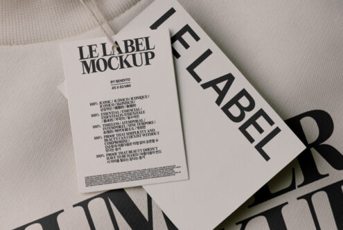 Label mockup on cream garment with white tag showing product information