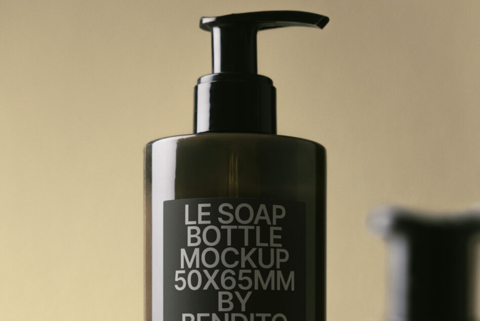 Dark glass pump bottle with minimal label against neutral backdrop