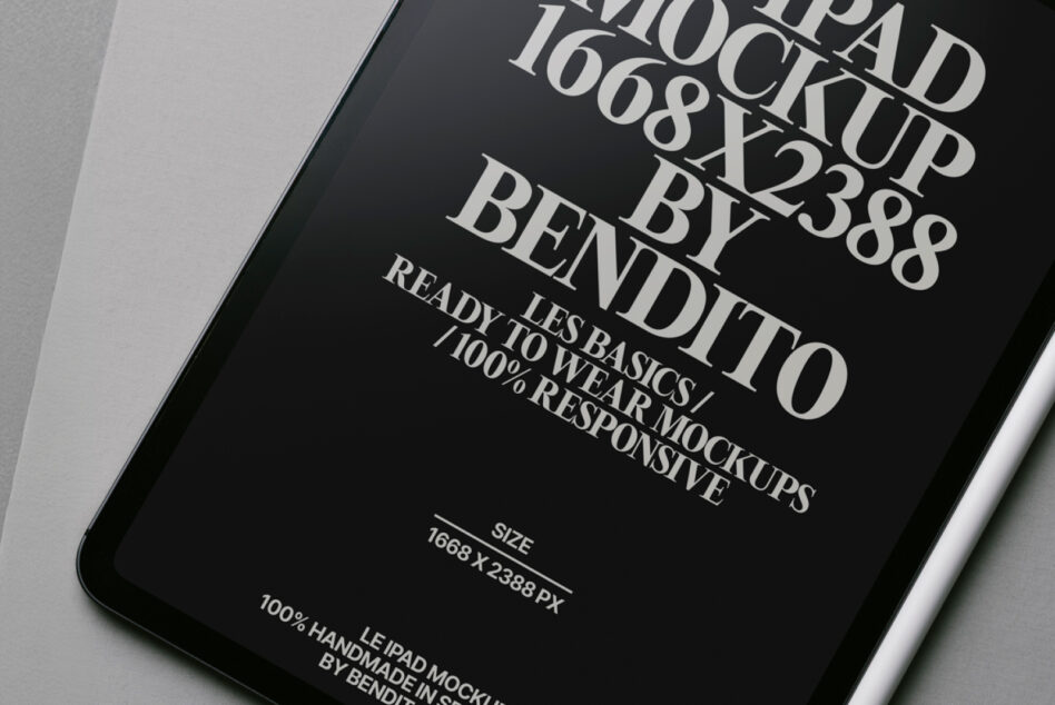 Close-up of dark iPad screen showing elegant serif font in white text