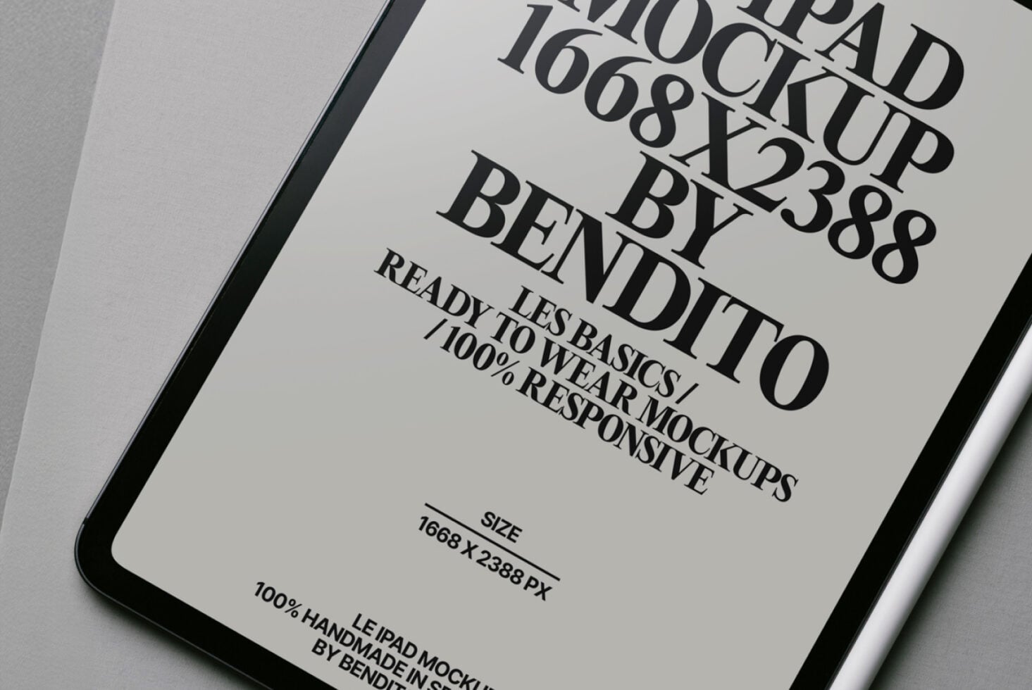 iPad screen angled view displaying minimalist serif typography layout