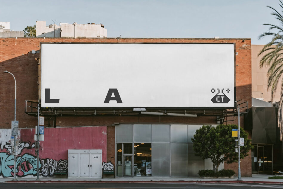 Blank white billboard with L A letters plus pixel icon on urban street
