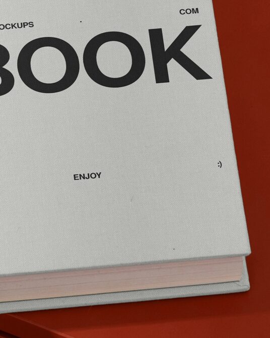 Open book mockup showing Book text on cream fabric cover