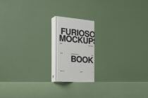 White hardcover book mockup with black typography on soft green background