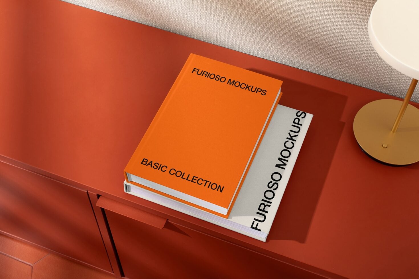 Stacked orange books on red shelf with white stationery mockup