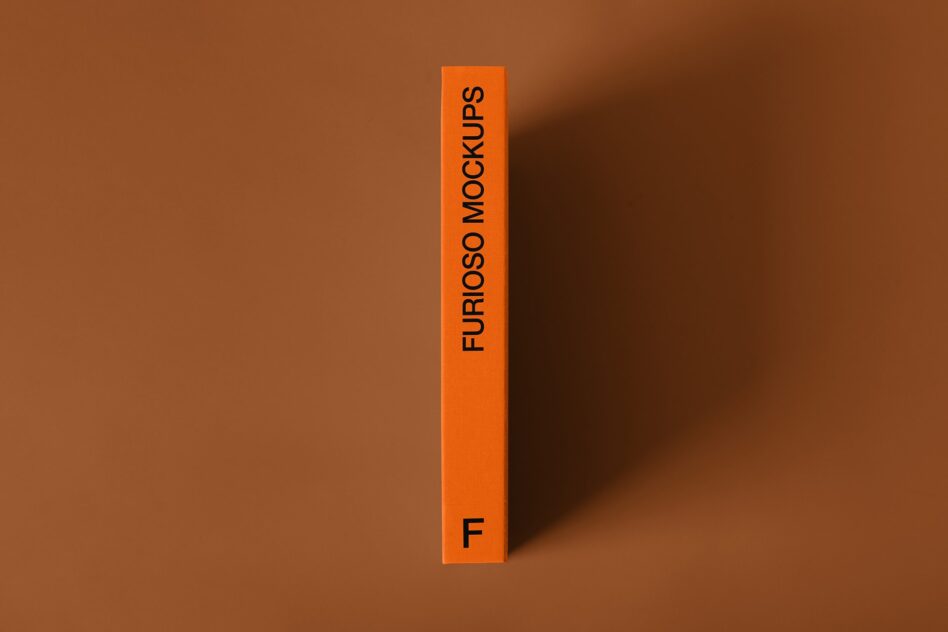 Bright orange vertical box with black text Furioso Mockups on brown background with shadow