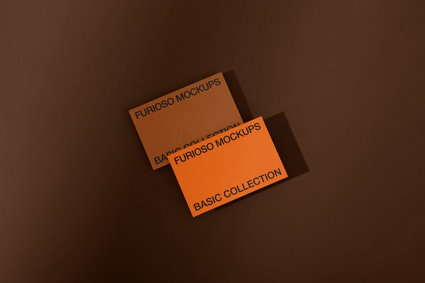 Stacked orange cards on brown background displaying Furioso Mockups Basic Collection with dramatic lighting