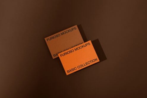 Stacked orange cards on brown background displaying Furioso Mockups Basic Collection with dramatic lighting