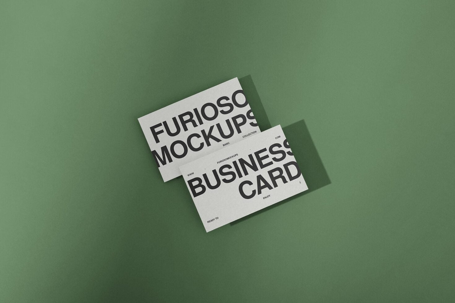 Two overlapping white business cards on sage green background showing Furioso Mockups typography with shadows