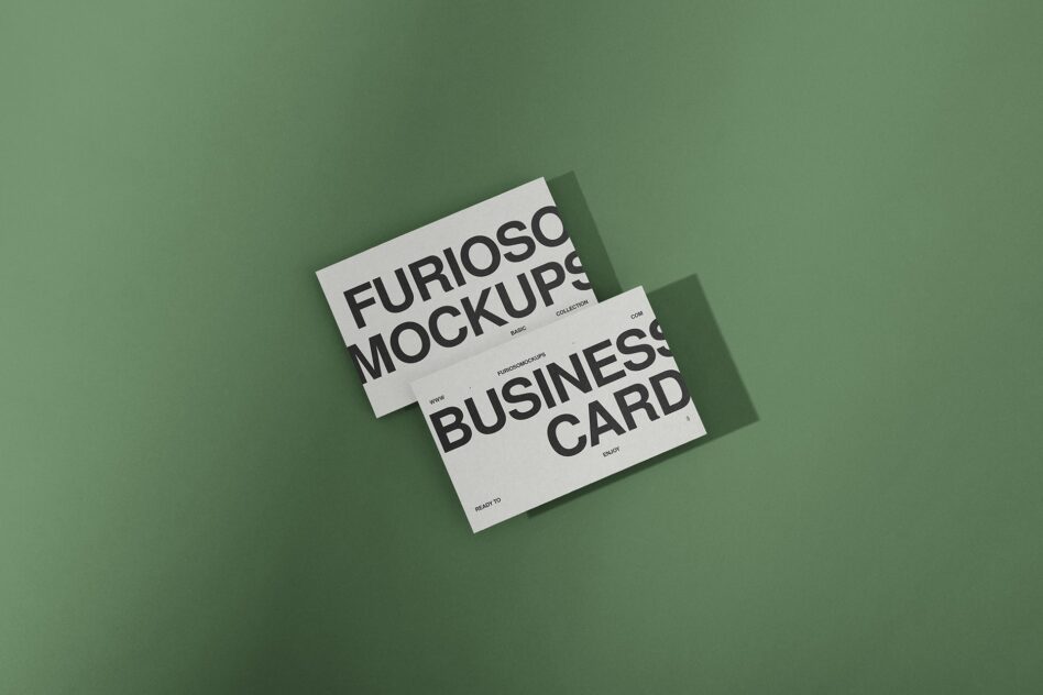 Two overlapping white business cards on sage green background showing Furioso Mockups typography with shadows