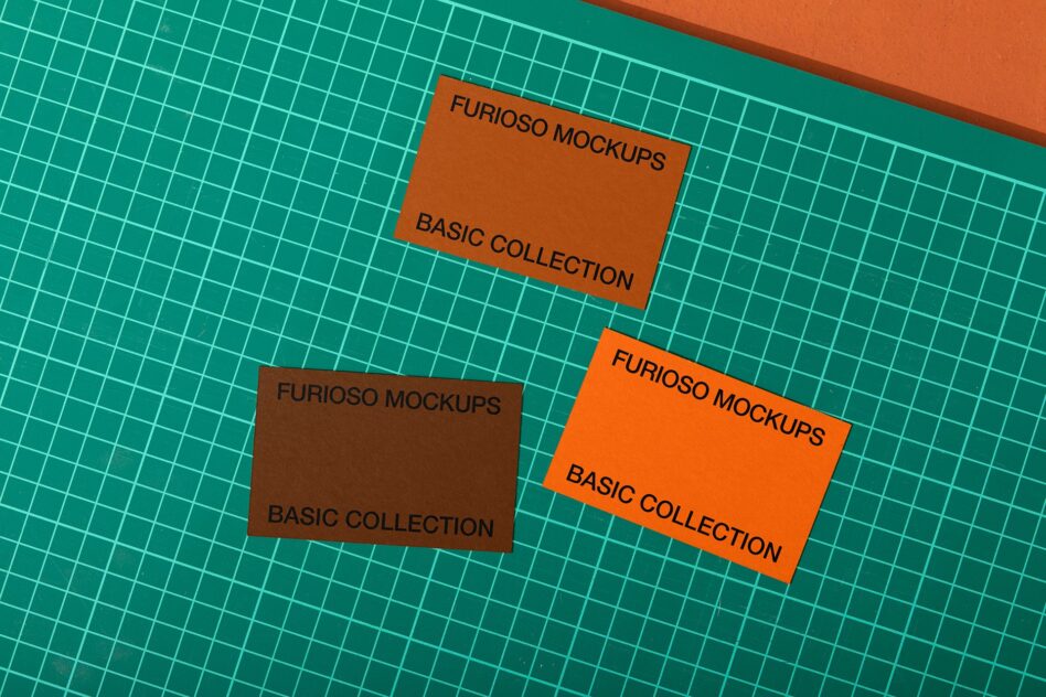 Colorful card mockups in orange, brown, teal on grid background