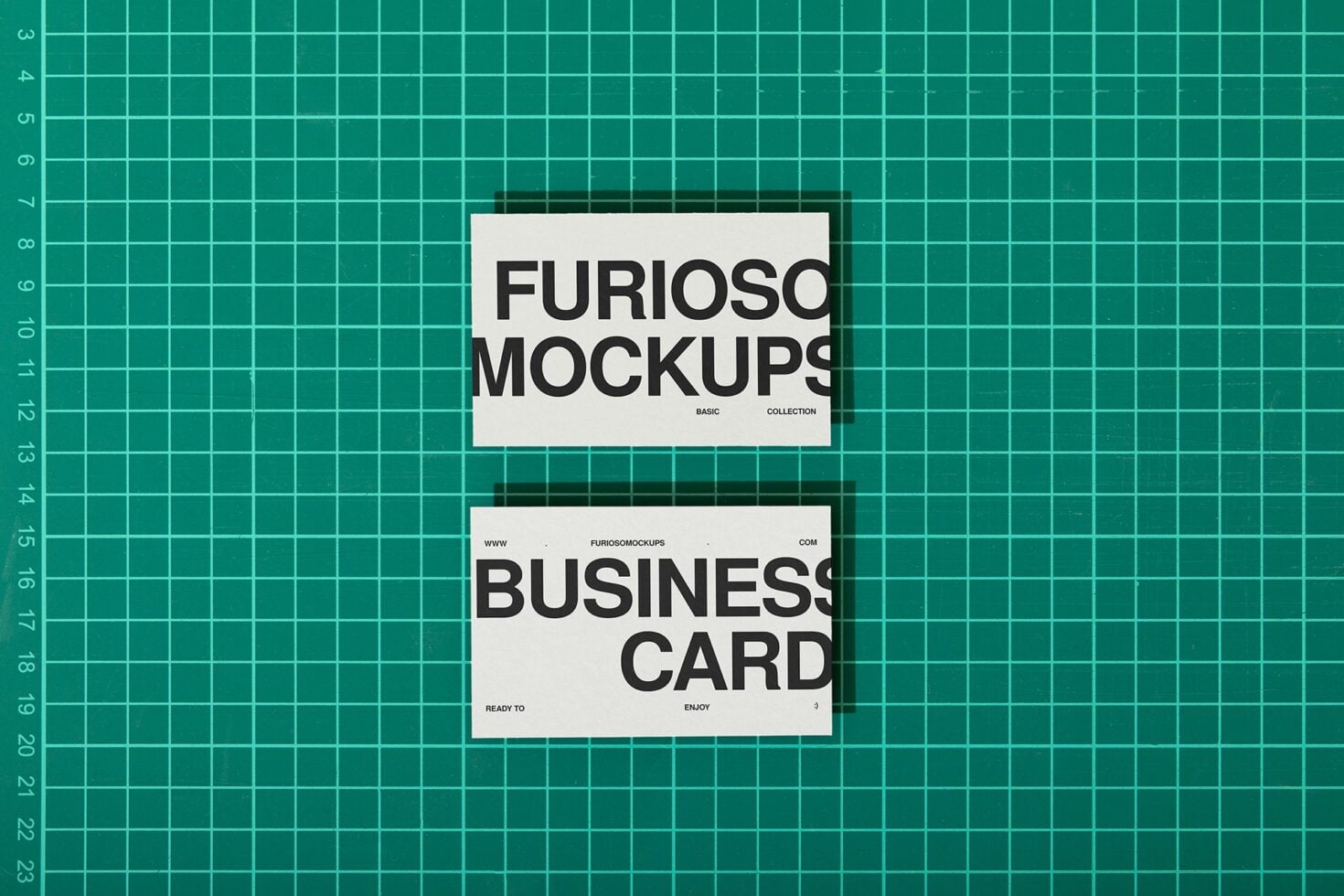 White business card mockups on teal grid background flat lay
