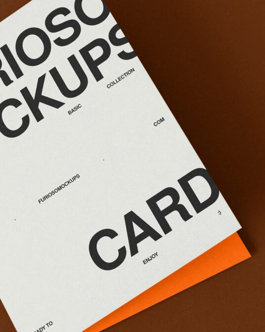 White card mockup spread on brown background with orange accent