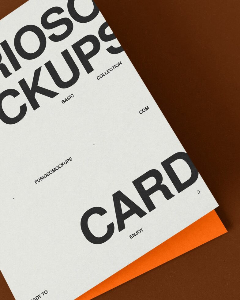 White card mockup spread on brown background with orange accent