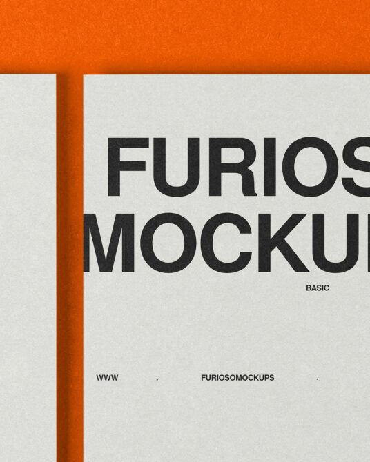 Close-up of printed material with orange edge binding showing Furioso Mockups text