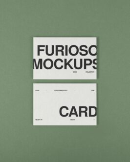 Two cream business cards stacked on sage green background with black typography
