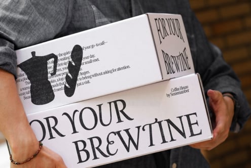 Open magazine spread showing For Your Brewtine design with cat silhouette, body copy layout