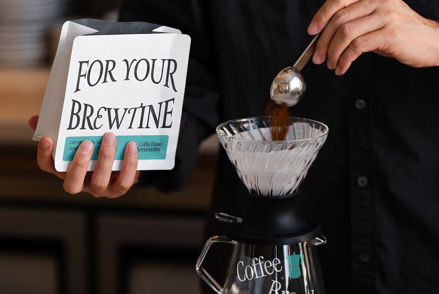 Hand holding white coffee order card, espresso pouring into glass funnel setup