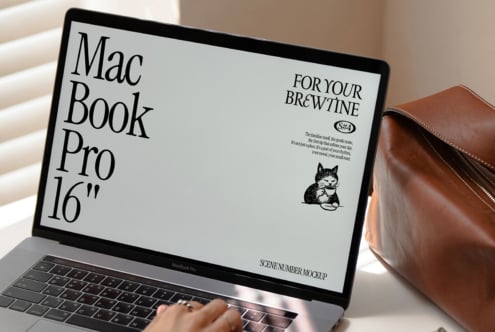 MacBook Pro 16 inch screen mockup with cafe branding on yellow
