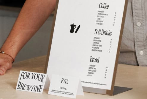 Cafe menu mockup with white table tents on wooden stand display