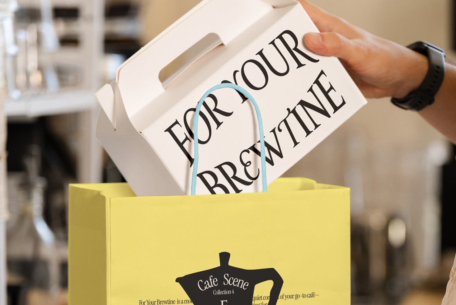 Yellow shopping bag holding white coffee cup with blue handle, cafe scene mockup