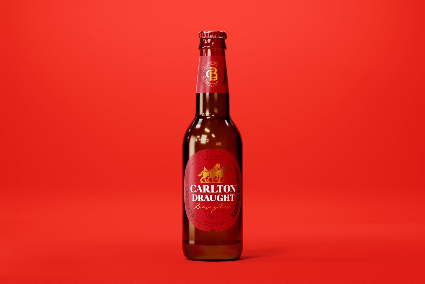 Full Carlton Draught beer bottle on red background studio lighting