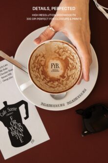 Overhead shot of latte cup with latte art, branding visible, high res closeup