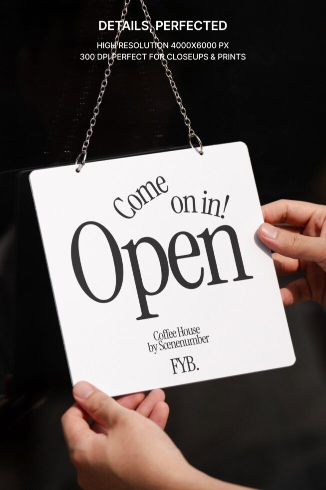 White square sign on chain reads Come on in Open for coffee house