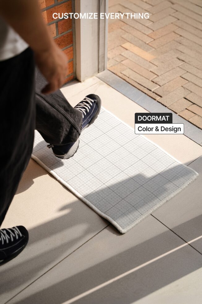 Doormat mockup with grid pattern in white, gray, charcoal colorways on entryway floor