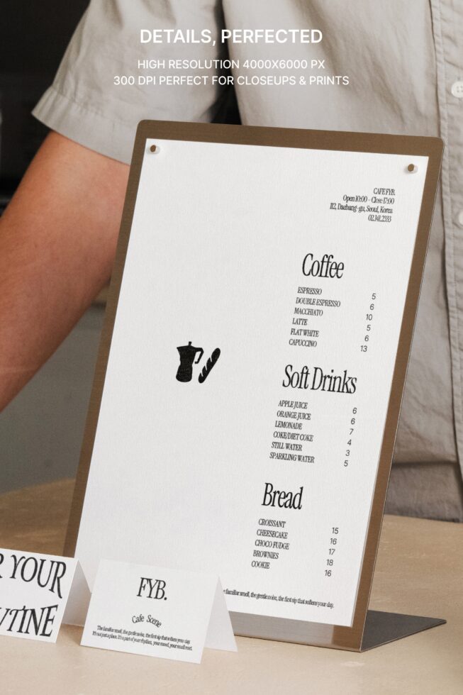 Brown kraft menu board held up showing coffee, soft drinks, bread pricing