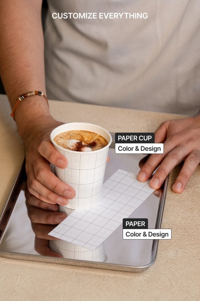 Hands holding cappuccino with grid paper cup, paper sleeve below showing customizable layouts