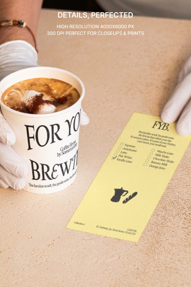 Hands in white gloves holding white coffee cup with latte, yellow menu card