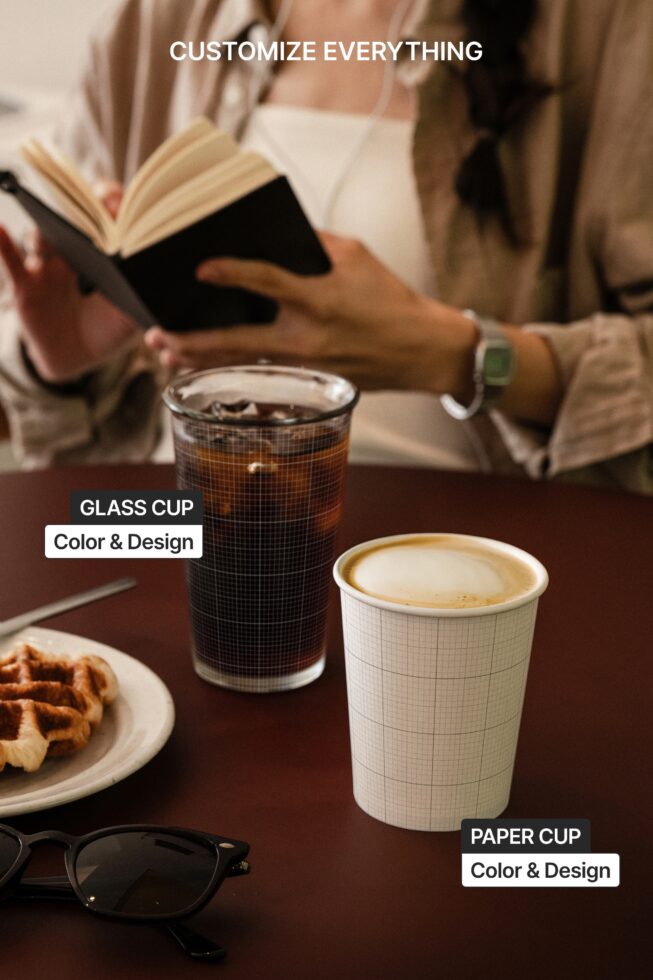 Coffee cup mockup with glass drink, paper cup, on desk with book, snacks