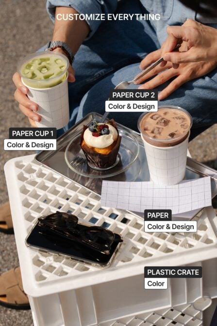 Close up hands holding green drink, chocolate dessert on tray with customizable cups