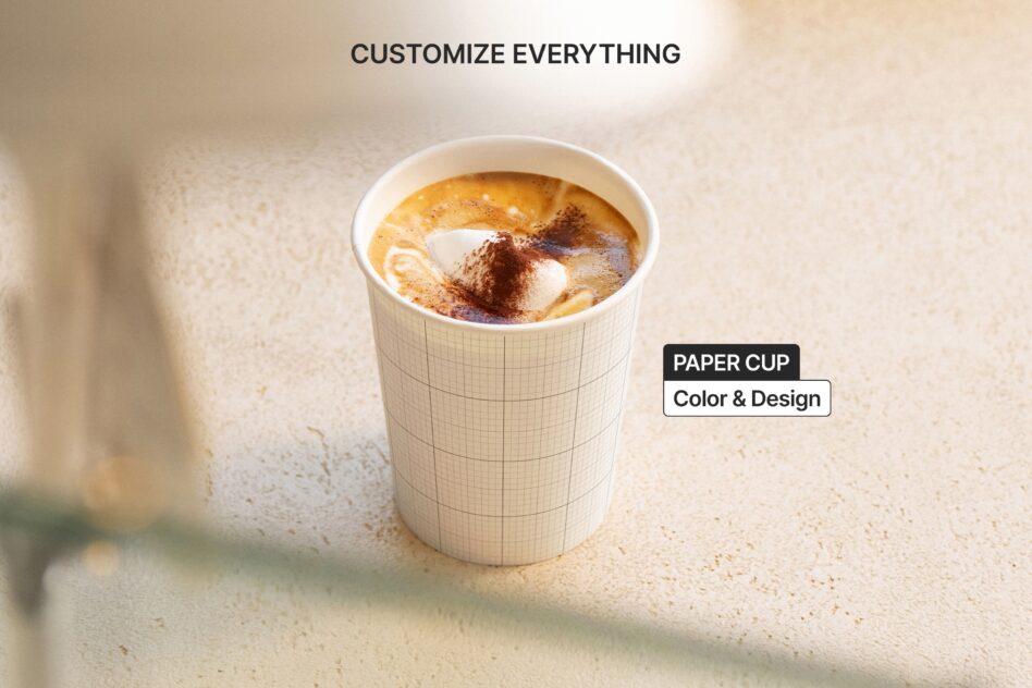 Single hot beverage cup with grid pattern sleeve, latte art topped with cinnamon
